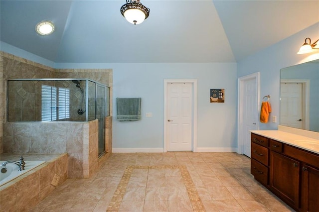 3423 Mulberry Lane Ct, Dacula, GA 30019 - full bathroom with vaulted ceiling, a garden tub, vanity, a stall shower, and tile patterned flooring