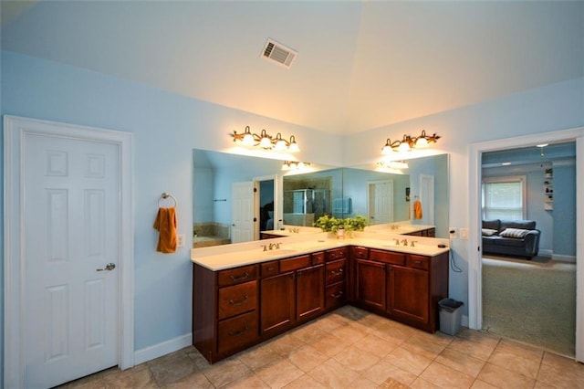 3423 Mulberry Lane Ct, Dacula, GA 30019 - bathroom featuring double vanity and vaulted ceiling