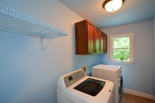 3423 Mulberry Lane Ct, Dacula, GA 30019 - washroom with separate washer and dryer, cabinet space, and light tile patterned floors