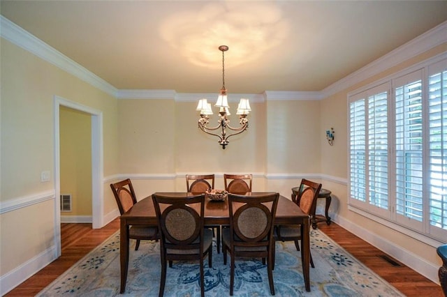 3423 Mulberry Lane Ct, Dacula, GA 30019 - dining area with a chandelier, wood finished floors, and crown molding