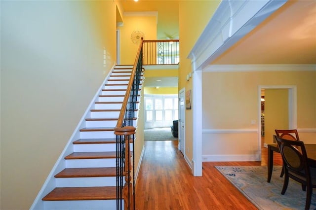 3423 Mulberry Lane Ct, Dacula, GA 30019 - stairs with ornamental molding, wood finished floors, and a high ceiling