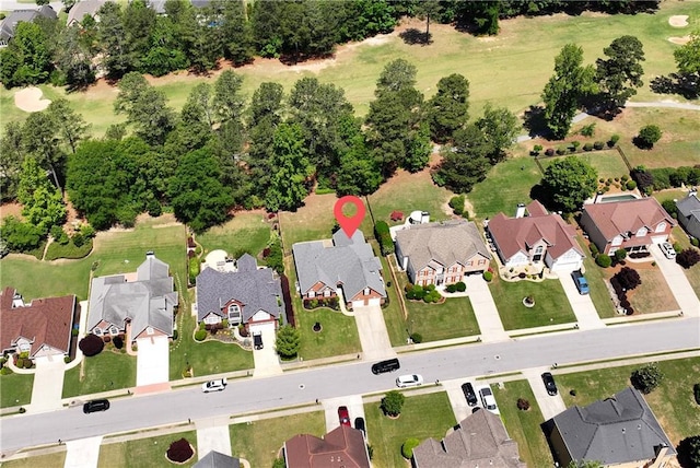 aerial view of property and surrounding area with nearby suburban area