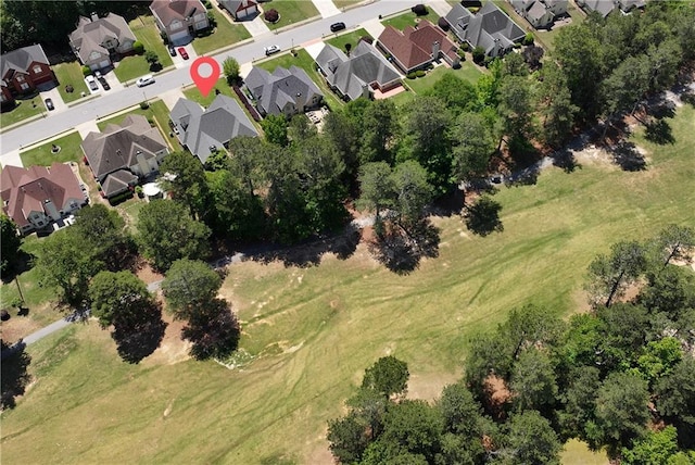 aerial view of property's location with nearby suburban area