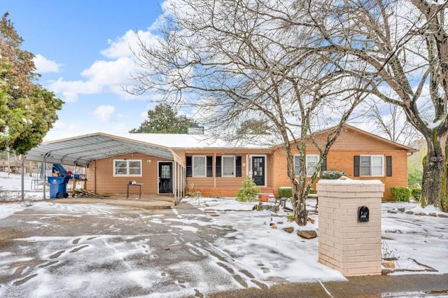 ranch-style house with a carport