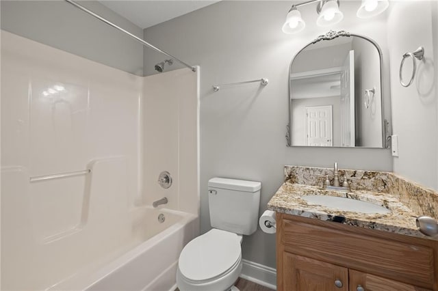 full bathroom with baseboards, toilet, bathtub / shower combination, and vanity