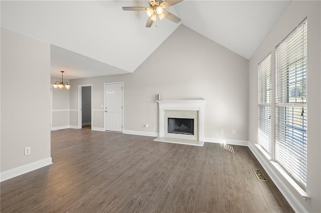 unfurnished living room featuring dark wood-style floors, a fireplace, and baseboards