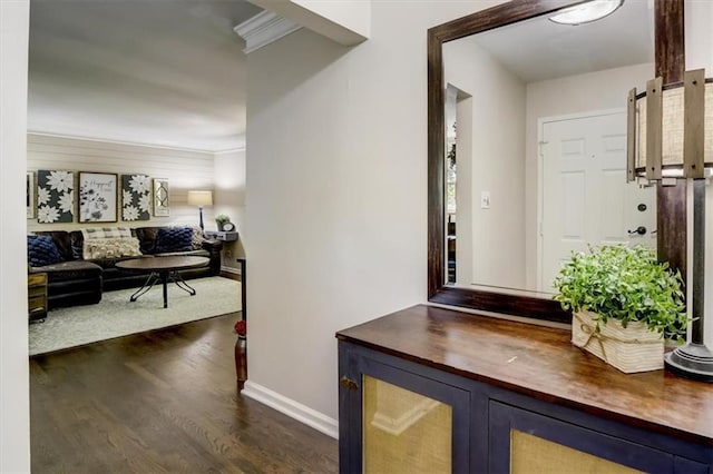 hall featuring dark hardwood / wood-style flooring and ornamental molding