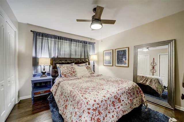 bedroom with ceiling fan, a closet, and dark hardwood / wood-style floors