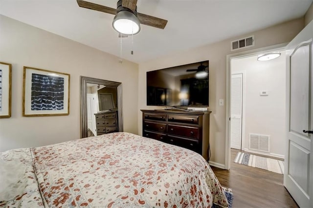 bedroom featuring ceiling fan and dark wood-type flooring