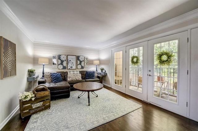 living area with french doors, dark hardwood / wood-style flooring, and ornamental molding