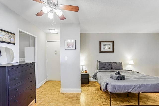 bedroom featuring ceiling fan and light parquet flooring