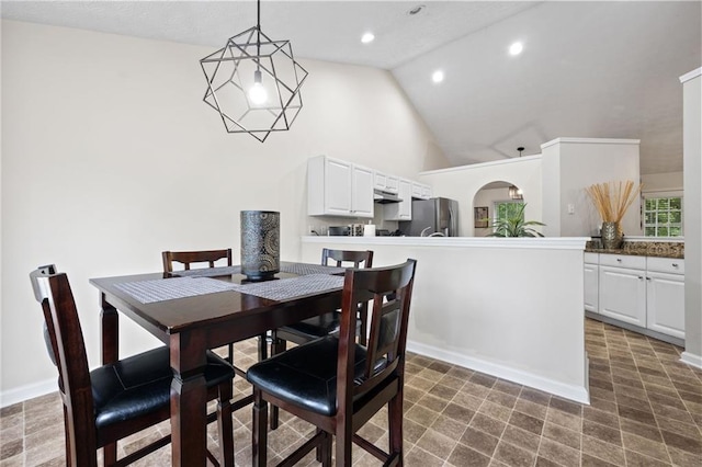 dining space with baseboards, recessed lighting, and high vaulted ceiling