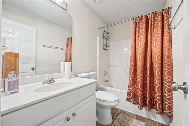 full bathroom featuring vanity, a textured ceiling, shower / tub combo, and toilet