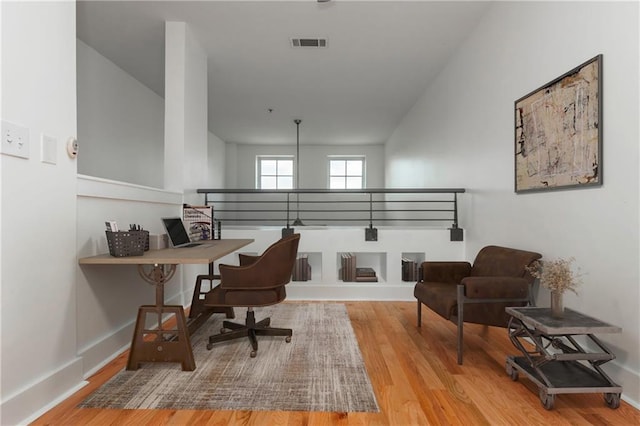 office with visible vents and wood finished floors