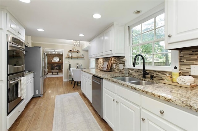 3719 Northbrook Ct, Atlanta, GA 30340 - kitchen featuring appliances with stainless steel finishes, a sink, white cabinets, backsplash, and recessed lighting