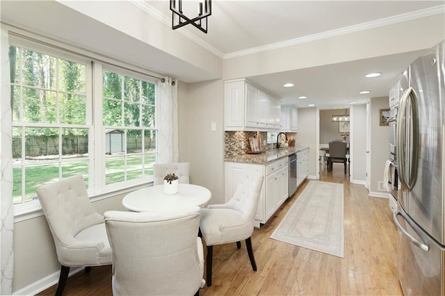 3719 Northbrook Ct, Atlanta, GA 30340 - dining space with ornamental molding, light wood-style floors, baseboards, and a chandelier