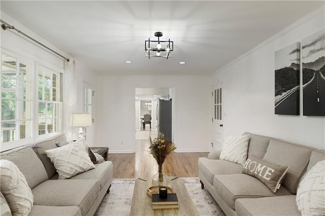 3719 Northbrook Ct, Atlanta, GA 30340 - living room featuring wood finished floors, a chandelier, ornamental molding, baseboards, and recessed lighting