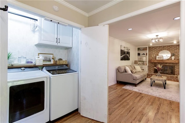 3719 Northbrook Ct, Atlanta, GA 30340 - laundry room featuring independent washer and dryer, light wood finished floors, crown molding, built in features, and recessed lighting
