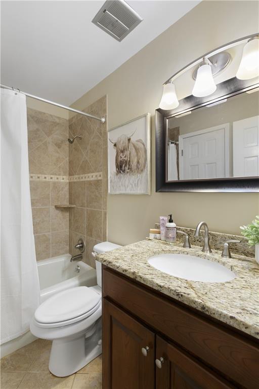 3719 Northbrook Ct, Atlanta, GA 30340 - full bathroom featuring vanity, shower / bath combination with curtain, toilet, and tile patterned floors