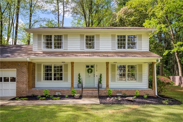 3719 Northbrook Ct, Atlanta, GA 30340 - view of front of house featuring a porch, an attached garage, and a front yard