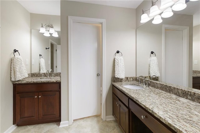 3719 Northbrook Ct, Atlanta, GA 30340 - bathroom featuring a chandelier, two vanities, and baseboards