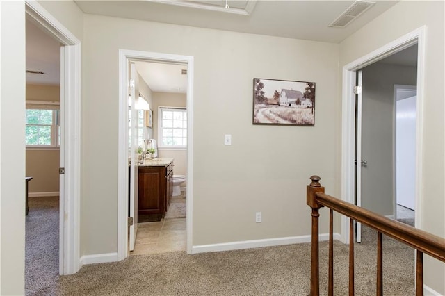 3719 Northbrook Ct, Atlanta, GA 30340 - hallway with light colored carpet, healthy amount of natural light, and baseboards