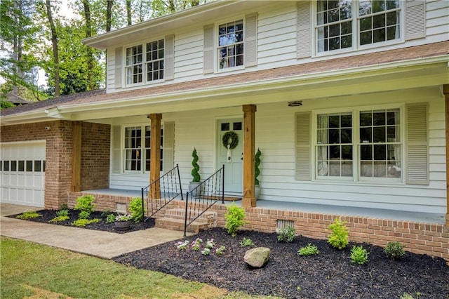 3719 Northbrook Ct, Atlanta, GA 30340 - view of front of home featuring a porch, a garage, brick siding, and crawl space