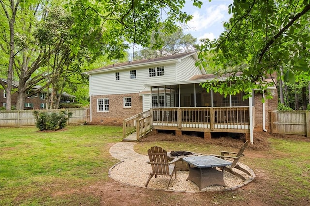 3719 Northbrook Ct, Atlanta, GA 30340 - back of property with an outdoor fire pit, brick siding, and a sunroom