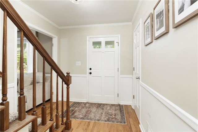 3719 Northbrook Ct, Atlanta, GA 30340 - foyer featuring light wood-style floors, ornamental molding, stairs, a wainscoted wall, and a decorative wall