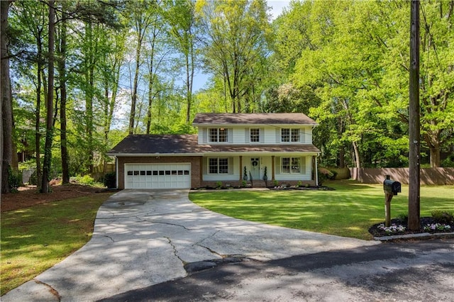 3719 Northbrook Ct, Atlanta, GA 30340 - view of front of house featuring a garage, concrete driveway, and covered porch