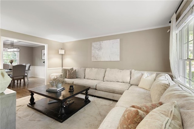 3719 Northbrook Ct, Atlanta, GA 30340 - living area with ornamental molding, a chandelier, plenty of natural light, a wainscoted wall, and wood finished floors