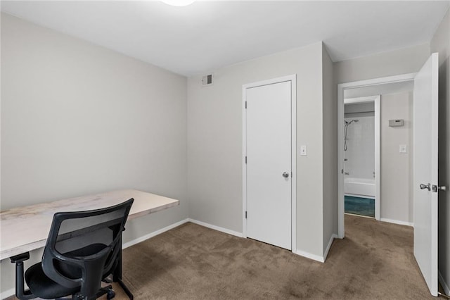 carpeted office space with visible vents and baseboards