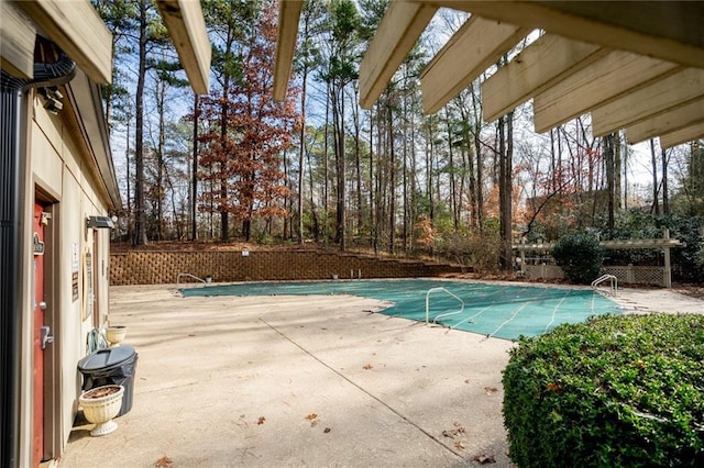 view of swimming pool with a fenced in pool and a patio area