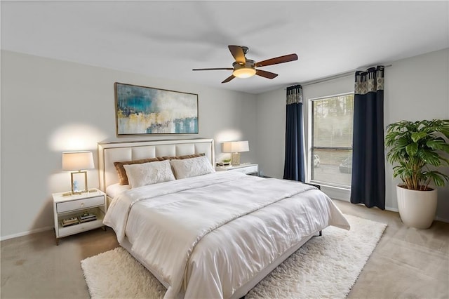 bedroom with baseboards and a ceiling fan