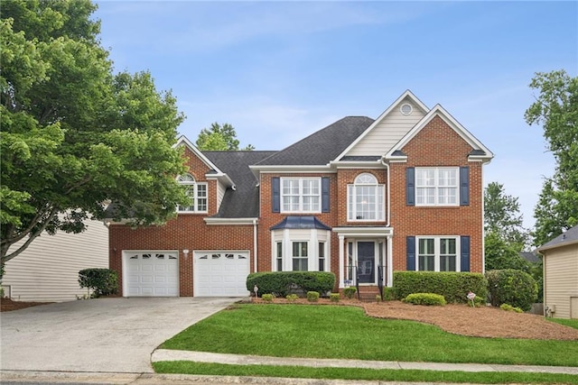 130 White Sands Ct, Suwanee, GA 30024 - view of front of house with driveway, brick siding, a front lawn, and an attached garage