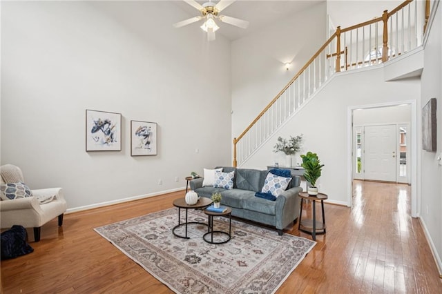 130 White Sands Ct, Suwanee, GA 30024 - living room with stairs, a high ceiling, wood-type flooring, and a ceiling fan