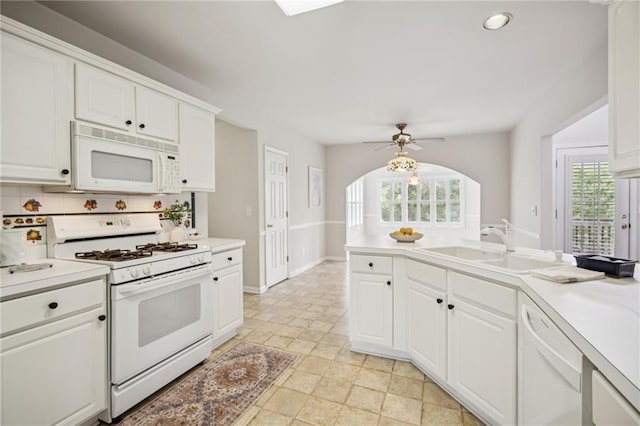 130 White Sands Ct, Suwanee, GA 30024 - kitchen with white appliances, plenty of natural light, light countertops, and recessed lighting