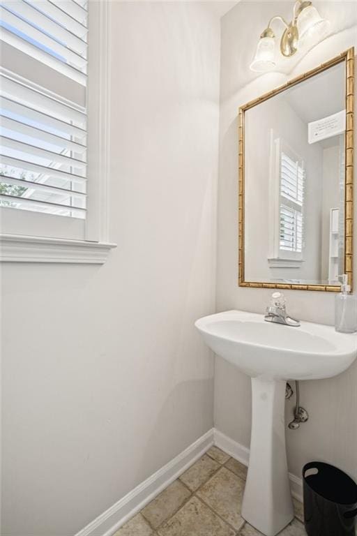 130 White Sands Ct, Suwanee, GA 30024 - bathroom featuring baseboards and a sink