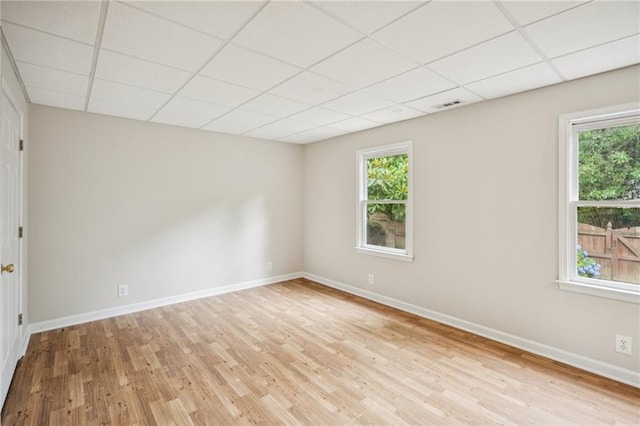 130 White Sands Ct, Suwanee, GA 30024 - unfurnished room with a paneled ceiling, wood finished floors, and healthy amount of natural light