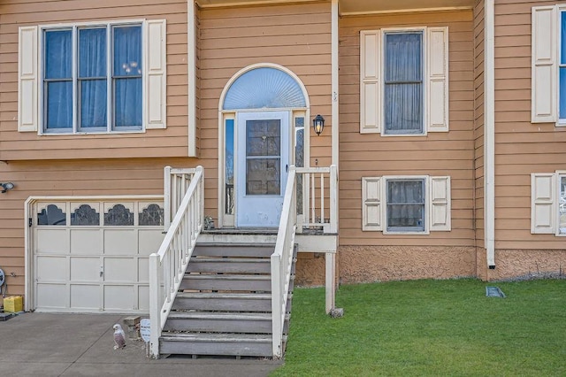 doorway to property with a garage