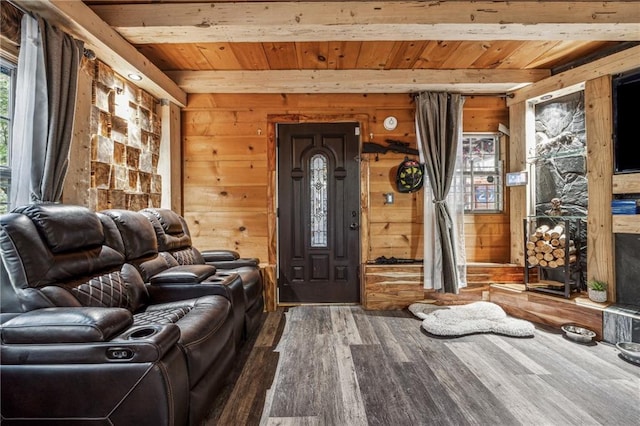 interior space featuring wooden ceiling, wood finished floors, and wooden walls