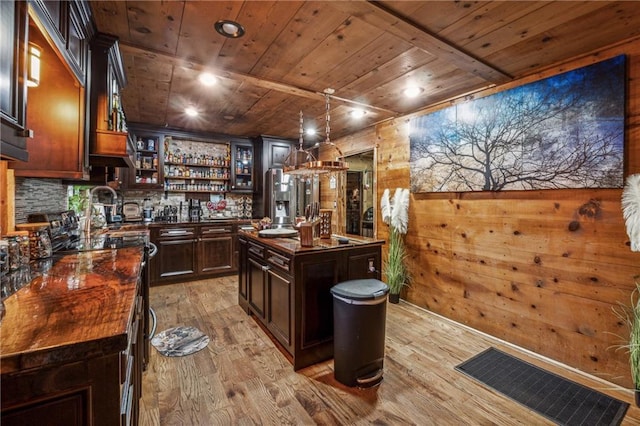 bar with wooden ceiling, indoor wet bar, and light wood-style floors