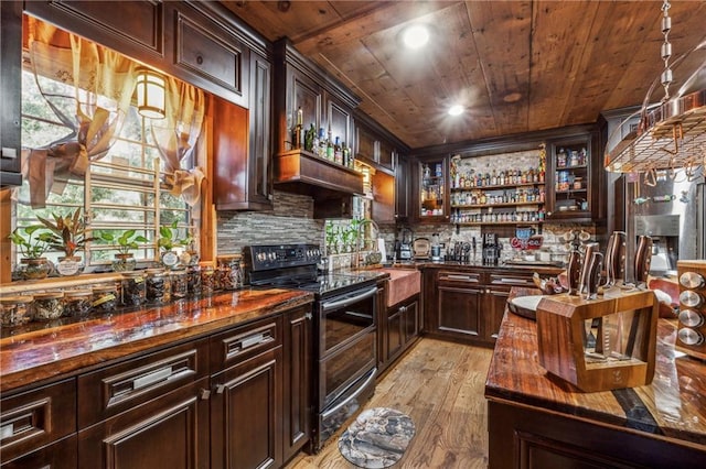 kitchen with range with two ovens, wood ceiling, light wood-style floors, dark brown cabinets, and open shelves