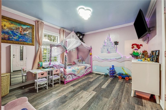 bedroom featuring wood finished floors and crown molding