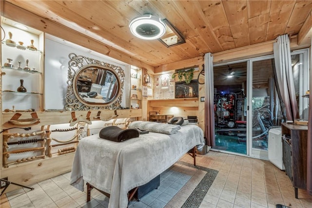 bedroom with wood ceiling, access to outside, and tile patterned flooring