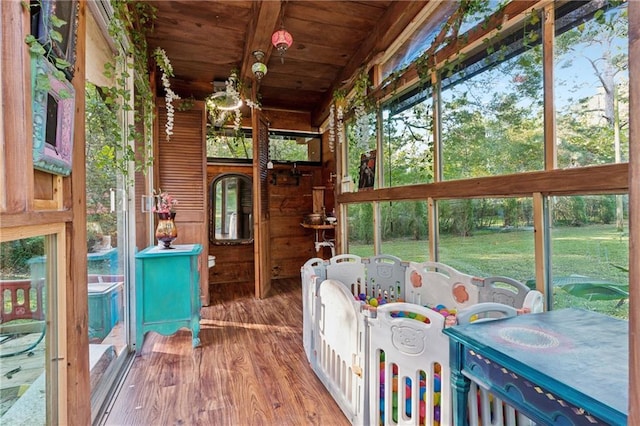 sunroom / solarium featuring wooden ceiling