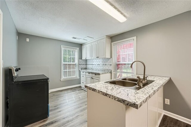 unfurnished living room with wood finished floors and baseboards