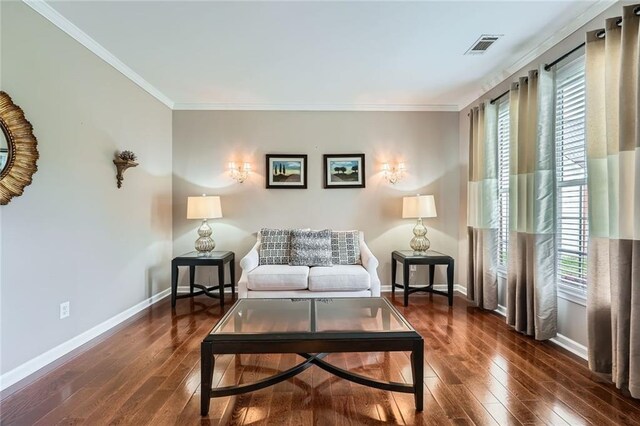 foyer with arched walkways, wood finished floors, a wainscoted wall, a chandelier, and crown molding