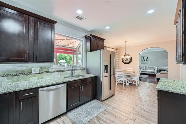 sitting room with hardwood / wood-style floors, baseboards, crown molding, and healthy amount of natural light