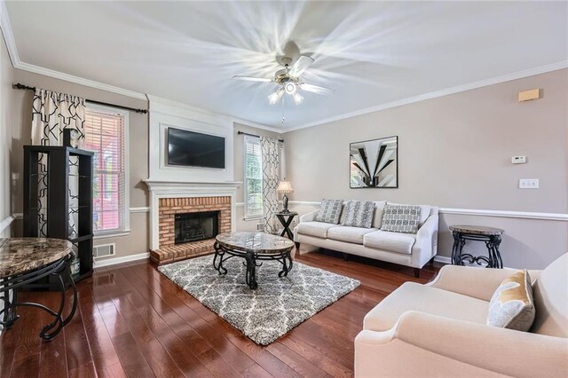kitchen with stainless steel appliances, a sink, ornamental molding, light wood-type flooring, and light stone counters